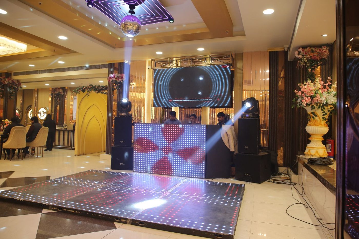 LED DJ floor in action with mirror ball, LED video wall and professional sound system at The Great Palace Banquet Hall